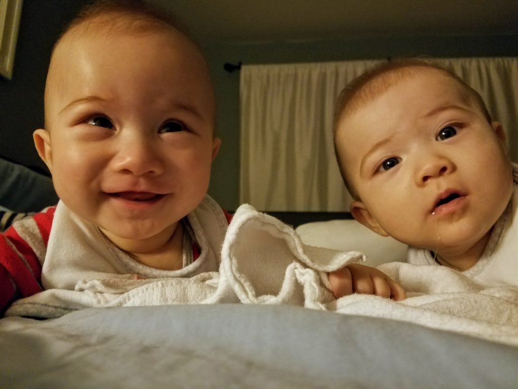 Infant twins relaxing at the hotel